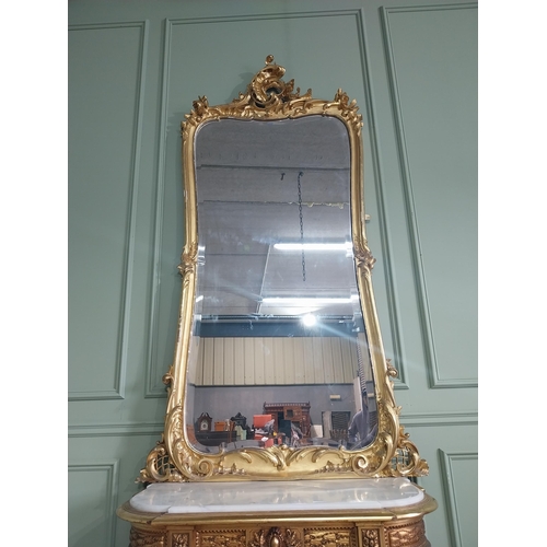 1402 - 19th C. French giltwood pier mirror surmounted with flowers. {186 cm H x 102 cm W}.