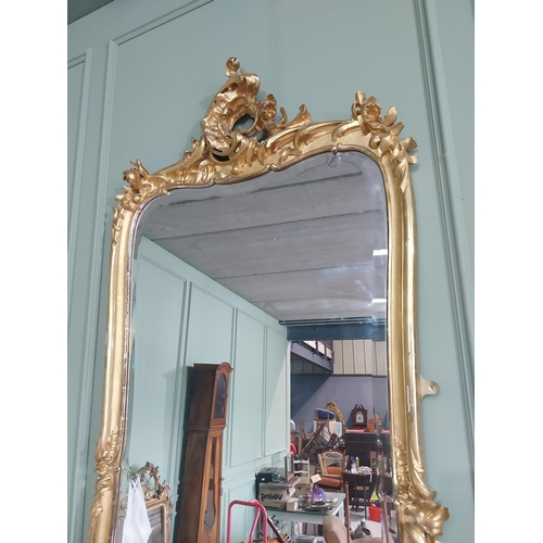 1402 - 19th C. French giltwood pier mirror surmounted with flowers. {186 cm H x 102 cm W}.