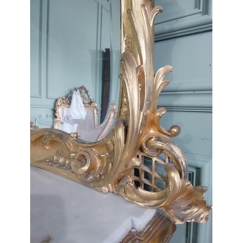 1402 - 19th C. French giltwood pier mirror surmounted with flowers. {186 cm H x 102 cm W}.