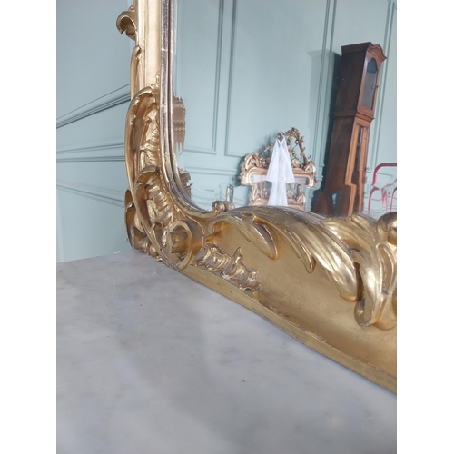 1402 - 19th C. French giltwood pier mirror surmounted with flowers. {186 cm H x 102 cm W}.