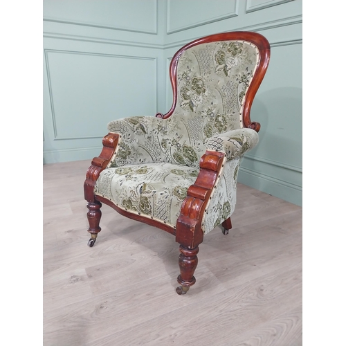 1408 - 19th C. mahogany and upholstered armchair raised on turned legs and castors {105 cm H x 73 cm W x 66... 