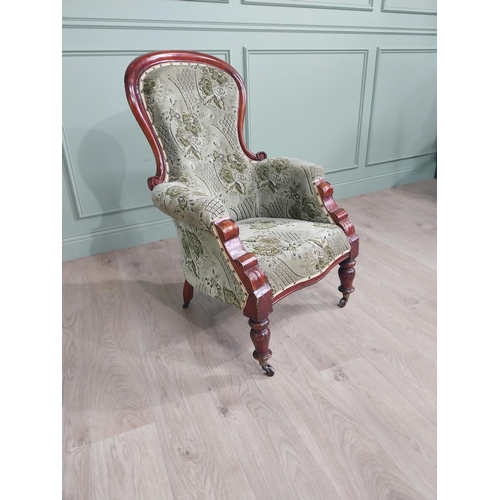 1408 - 19th C. mahogany and upholstered armchair raised on turned legs and castors {105 cm H x 73 cm W x 66... 