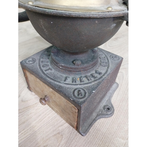 148 - Early 20th C. cast iron and brass wheel coffee grinder {50 cm H x 40 cm W x 34 cm D}.