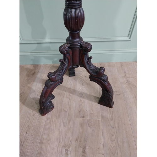 157 - 19th C. carved mahogany torchiere raised on three out swept feet {153 cm H x 50 cm Dia.}.