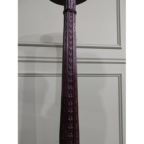 157 - 19th C. carved mahogany torchiere raised on three out swept feet {153 cm H x 50 cm Dia.}.