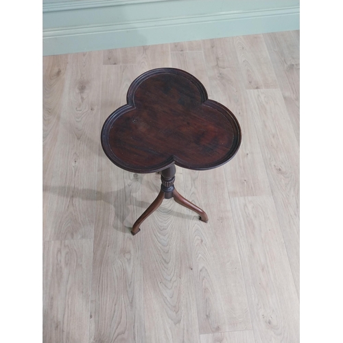 160 - Edwardian mahogany shamrock wine table raised on turned column and three out swept feet {58 cm H x 3... 