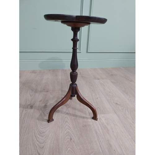 160 - Edwardian mahogany shamrock wine table raised on turned column and three out swept feet {58 cm H x 3... 