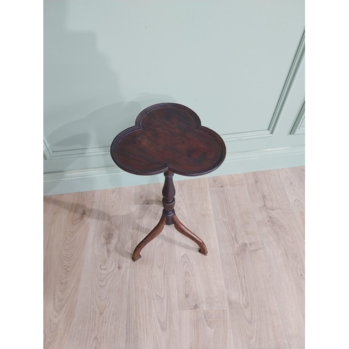 160 - Edwardian mahogany shamrock wine table raised on turned column and three out swept feet {58 cm H x 3... 