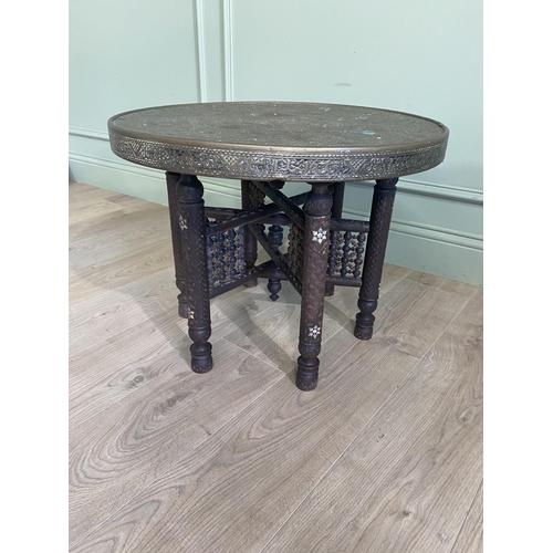 161 - Early 20th C. Middle Eastern carved hardwood coffee table with embossed brass top {47 cm H x 60 cm D... 