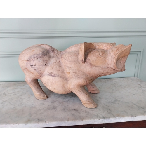 173 - Carved hardwood model of a Pig {27 cm H x 54 cm W x 20 cm D}.