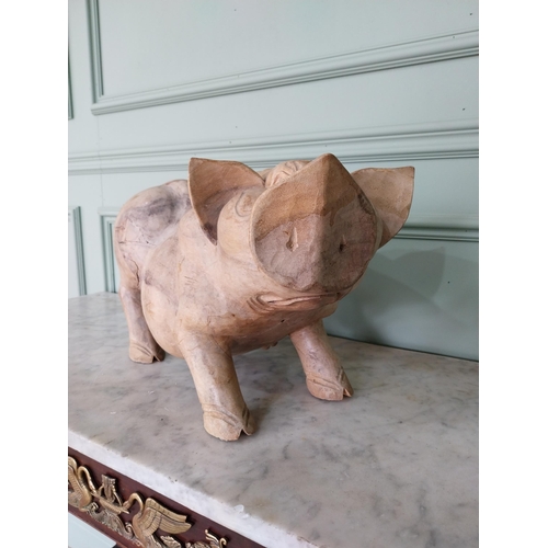 173 - Carved hardwood model of a Pig {27 cm H x 54 cm W x 20 cm D}.