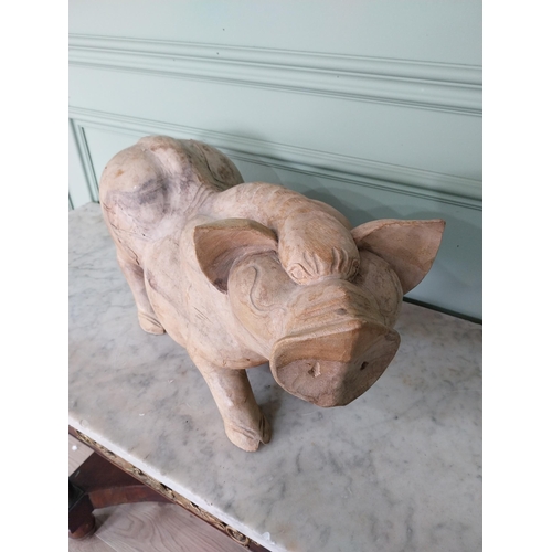 173 - Carved hardwood model of a Pig {27 cm H x 54 cm W x 20 cm D}.