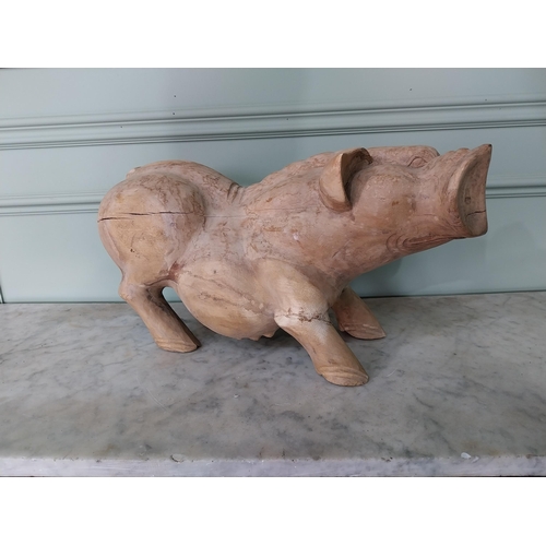 174 - Carved hardwood model of a Pig {27 cm H x 54 cm W x 20 cm D}.