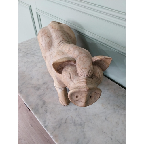 174 - Carved hardwood model of a Pig {27 cm H x 54 cm W x 20 cm D}.