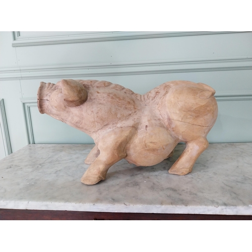 174 - Carved hardwood model of a Pig {27 cm H x 54 cm W x 20 cm D}.