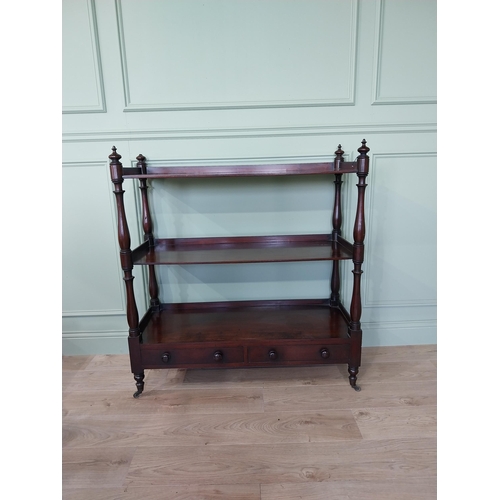 193 - Good quality 19th C. mahogany three tiered dumb waiter with two short drawers raised on turned feet ... 