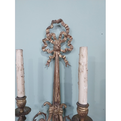 194 - Pair of good quality early 20th C. gilded brass French wall sconces {59 cm H x 27 cm W x 12 cm D}.