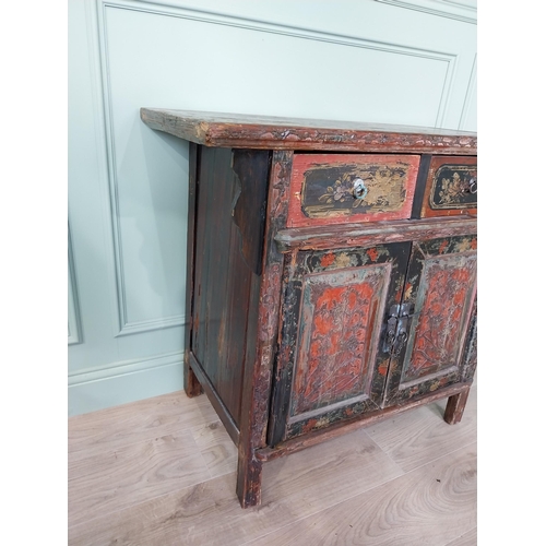 196 - Oriental painted hardwood side cabinet with two short drawers over two blind doors raised on square ... 