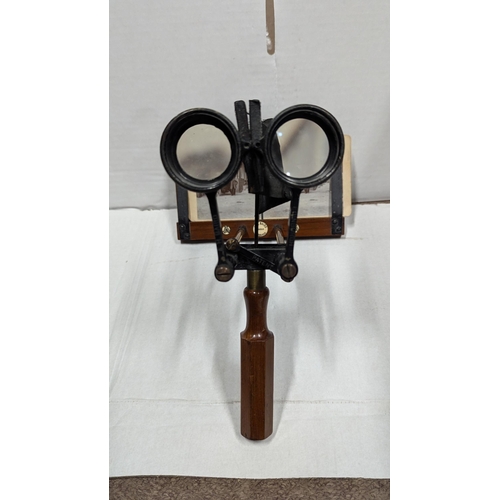 2013 - Two viewers, one handheld metal and wood viewer and one metal table top viewer