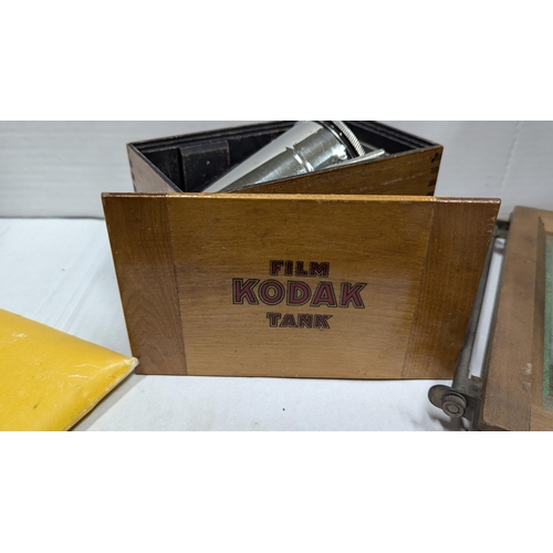 2014 - Boxed Film Kodak Tank developing kit with darkroom protective filter and printers frame