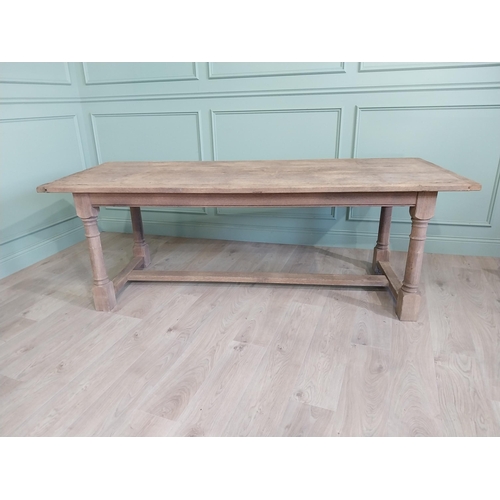 205 - Early 20th C. French bleached oak kitchen table raised on turned legs and single stretcher {76 cm H ... 