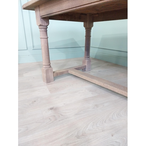 205 - Early 20th C. French bleached oak kitchen table raised on turned legs and single stretcher {76 cm H ... 