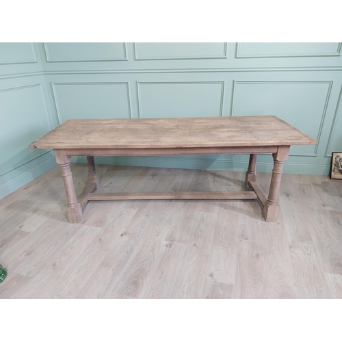 205 - Early 20th C. French bleached oak kitchen table raised on turned legs and single stretcher {76 cm H ... 