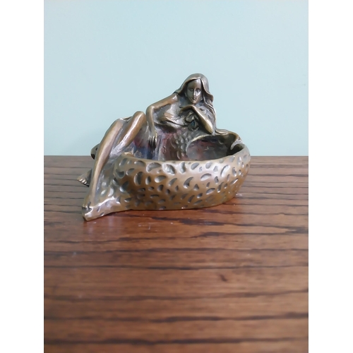 207 - Art Nouveau bronze ashtray in the form of a Lady {10 cm H x 14 cm W x 10 cm D}.