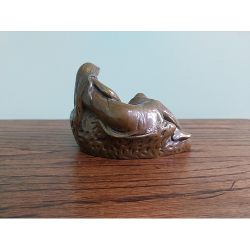 207 - Art Nouveau bronze ashtray in the form of a Lady {10 cm H x 14 cm W x 10 cm D}.