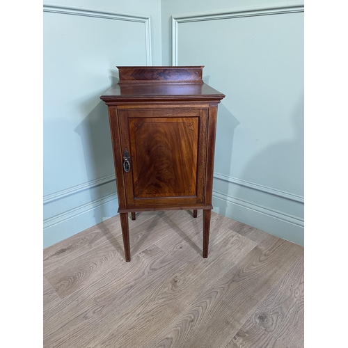 212 - Edwardian mahogany and ebonised inlaid pot cupboard with single door raised on square tapered legs {... 