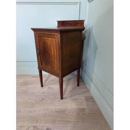 212 - Edwardian mahogany and ebonised inlaid pot cupboard with single door raised on square tapered legs {... 