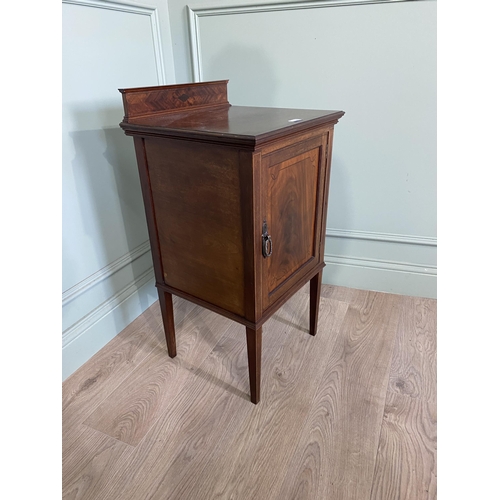 212 - Edwardian mahogany and ebonised inlaid pot cupboard with single door raised on square tapered legs {... 