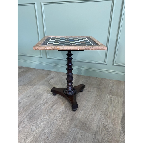 221 - William IV mahogany chess table with specimen marble top raised on turned column and platform base {... 