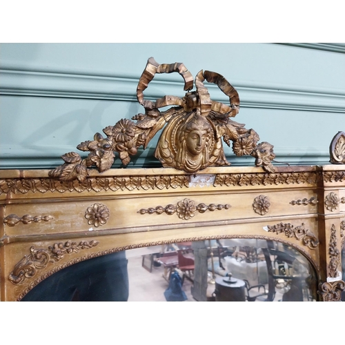 228 - 19th C. giltwood over mantle mirror decorated with central mask and swags {120 cm H x 124 cm W}.