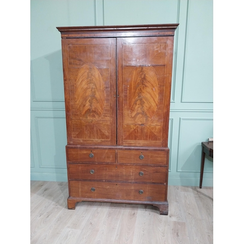 233 - Georgian mahogany and satinwood linen press with two doors {214 cm H x 127 cm W}.