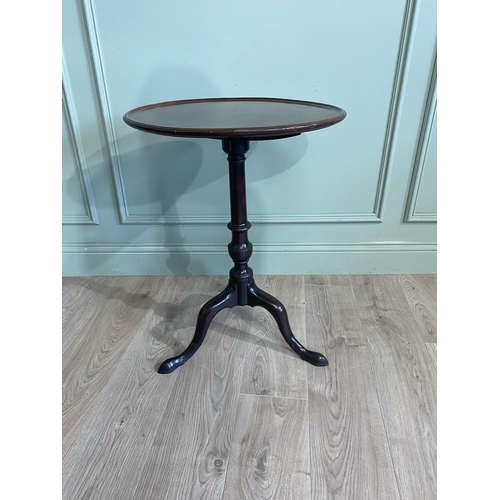 242 - Irish Georgian mahogany tilt  top wine table raised on turned column and three out swept feet. {71 c... 