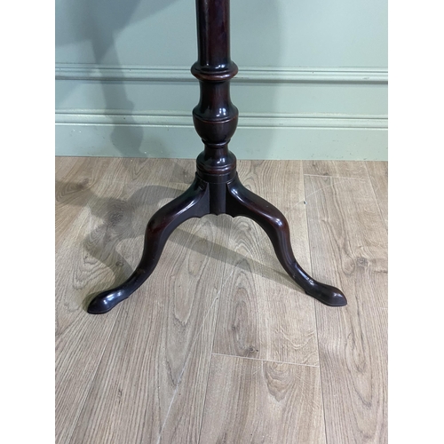 242 - Irish Georgian mahogany tilt  top wine table raised on turned column and three out swept feet. {71 c... 