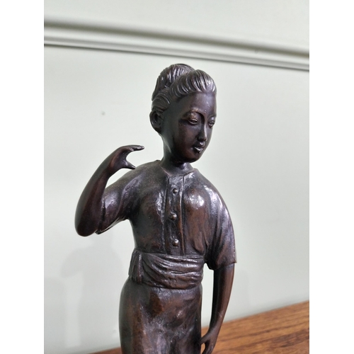 256 - Bronze figural group of a Boy and Girl mounted on a wooden plinth {23 cm H x 36 cm W x 18  cm D}.