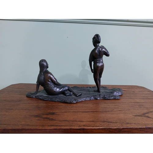 256 - Bronze figural group of a Boy and Girl mounted on a wooden plinth {23 cm H x 36 cm W x 18  cm D}.