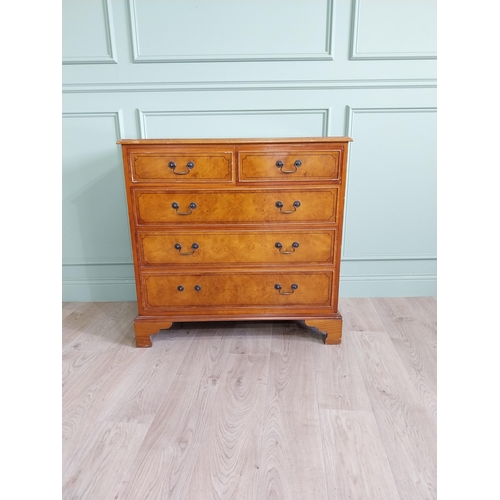 261 - Inlaid yew wood chest of drawers with two short drawers over three long graduated drawers raised on ... 