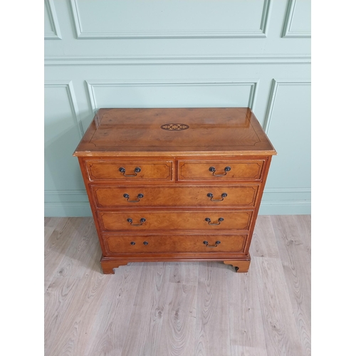 261 - Inlaid yew wood chest of drawers with two short drawers over three long graduated drawers raised on ... 