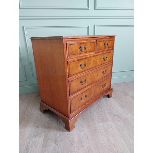 261 - Inlaid yew wood chest of drawers with two short drawers over three long graduated drawers raised on ... 