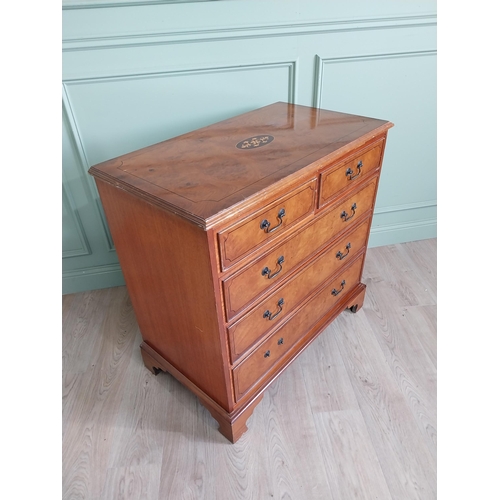 261 - Inlaid yew wood chest of drawers with two short drawers over three long graduated drawers raised on ... 