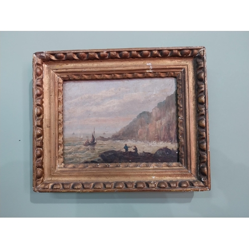 267 - 19th C. figures on rocks seascape scene oil on canvas mounted in giltwood frame {23 cm H x 28 cm W}.