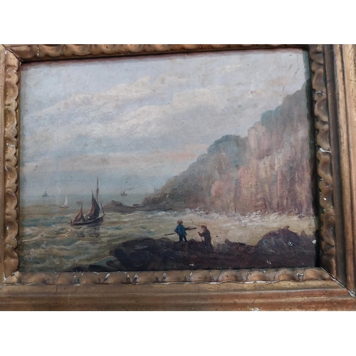 267 - 19th C. figures on rocks seascape scene oil on canvas mounted in giltwood frame {23 cm H x 28 cm W}.