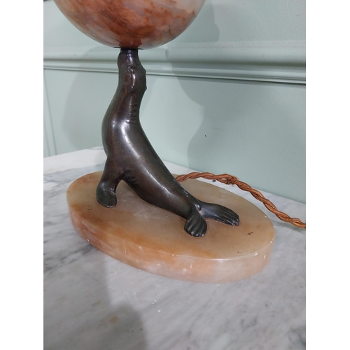 29 - Art Deco alabaster and bronzed spelter table lamp in the form of a Seal {30 cm H x 21 cm W x 14 cm D... 