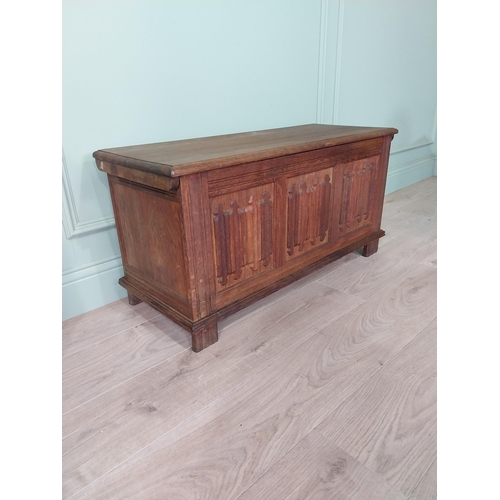 296 - Oak blanket box in the Tudor style {47 cm H x 94 cm W x 38 cm D}.