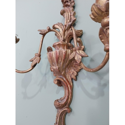 297 - Pair of giltwood wall lights in the Rococo manner. {64 cm H x 32 cm W x 17 cm W}.