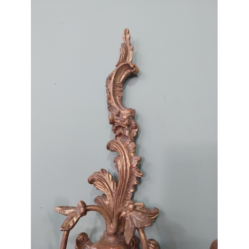 297 - Pair of giltwood wall lights in the Rococo manner. {64 cm H x 32 cm W x 17 cm W}.