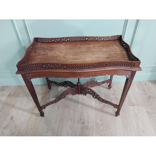 298 - Georgian mahogany tea table in the Chippendale style with pierced gallery raised on four tapered leg... 